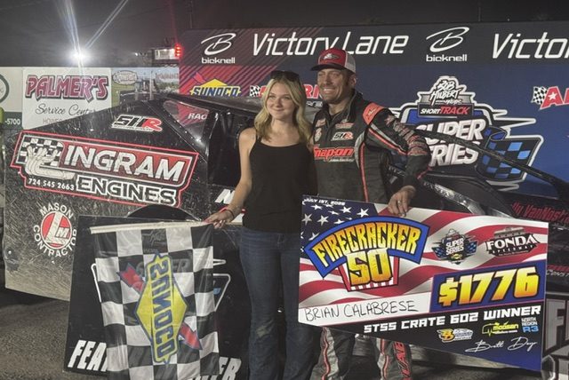 Brian Calabrese of Johnstown celebrates with his daughter Bella after winning the Sportsman portion of the Firecracker 50 on Thursday at Fonda