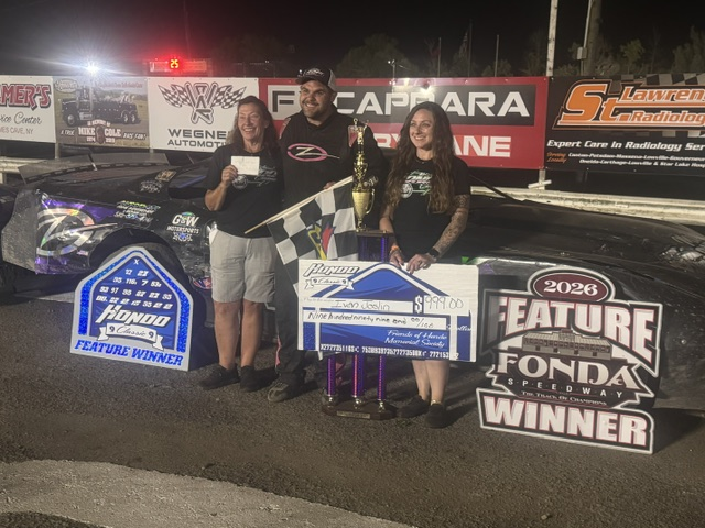 Ivan Joslin of Fultonville celebrates his first win in the Hondo Classic with event organizers Kelley and Kaitlyn Keefe at Fonda on Saturday